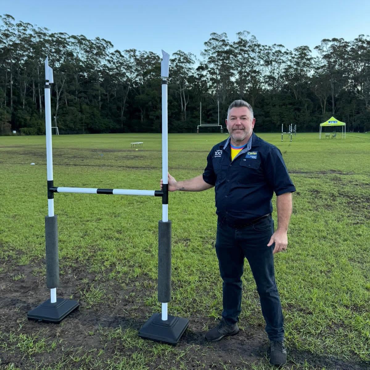 Brad Pesavento with donated mini goal posts for Berkeley Vale Panthers junior players