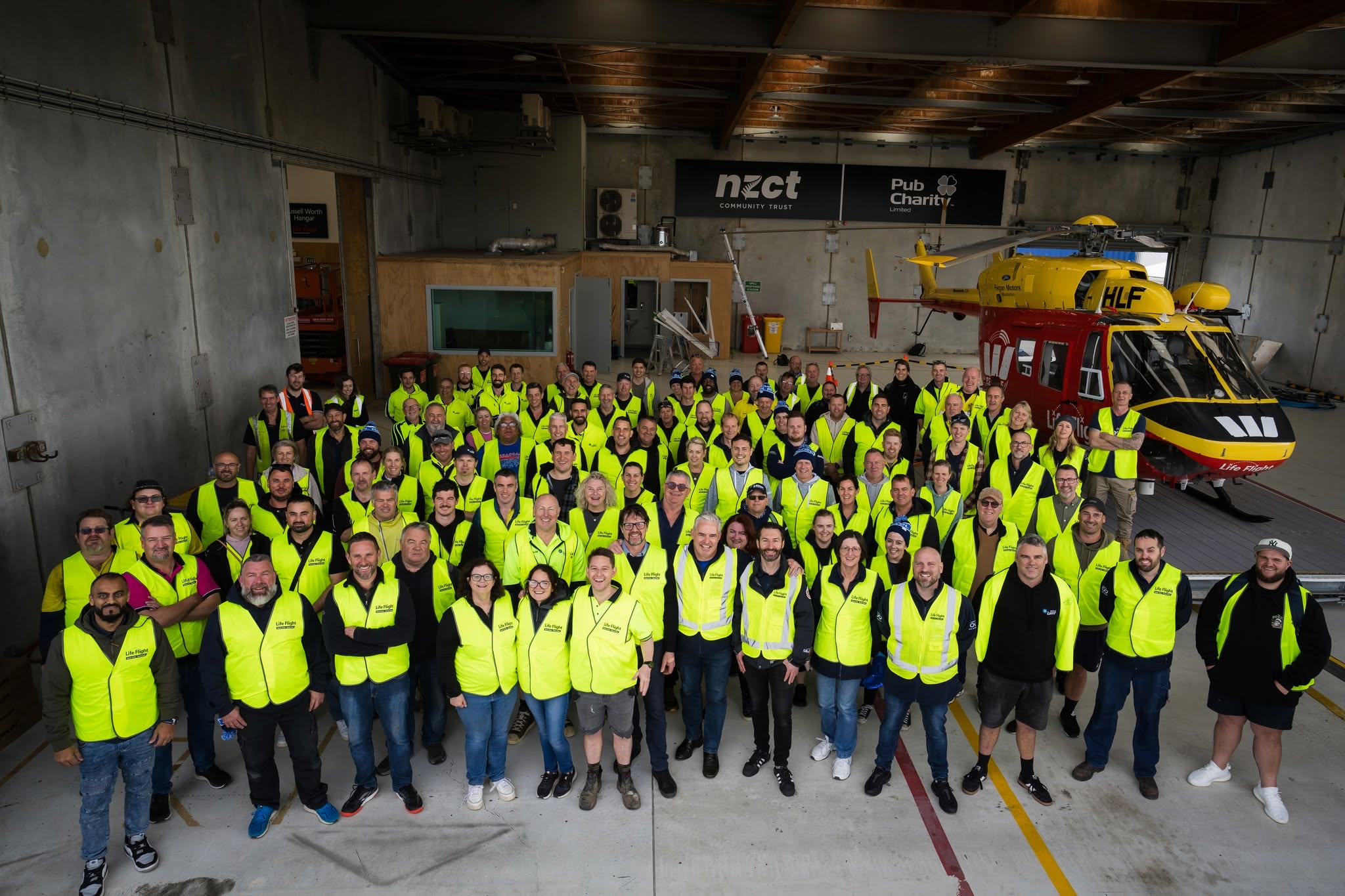 The full Taskforce 2024 crew of 100+ tradies at the Life Flight Westpac Rescue Helicopter base in Wellington NZ